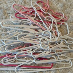 Like New, 15 Assorted Toddler Hangers in Pink/White
